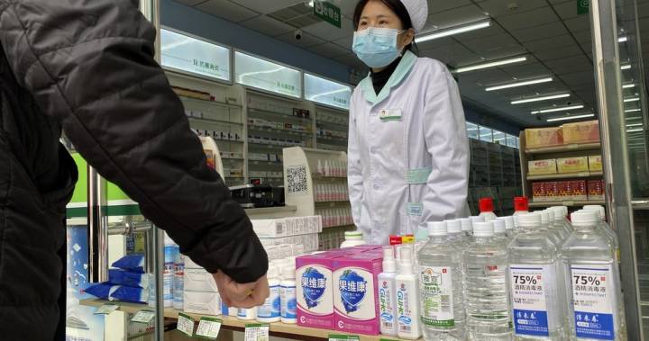 New virus cases in China drop as authorities modify detection method again