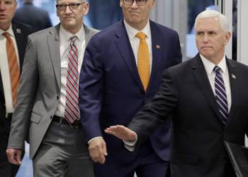 In coronavirus combat, Mike Pence is caught between Trump and a hard place