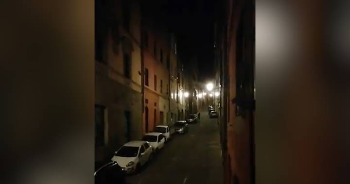 Watch Italians lean out home windows, sing together during coronavirus lockdown