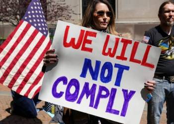 Hundreds protest in Michigan as governor seeks to extend coronavirus lockdown