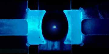 This tiny glass bead has been quantum chilled to near absolute zero